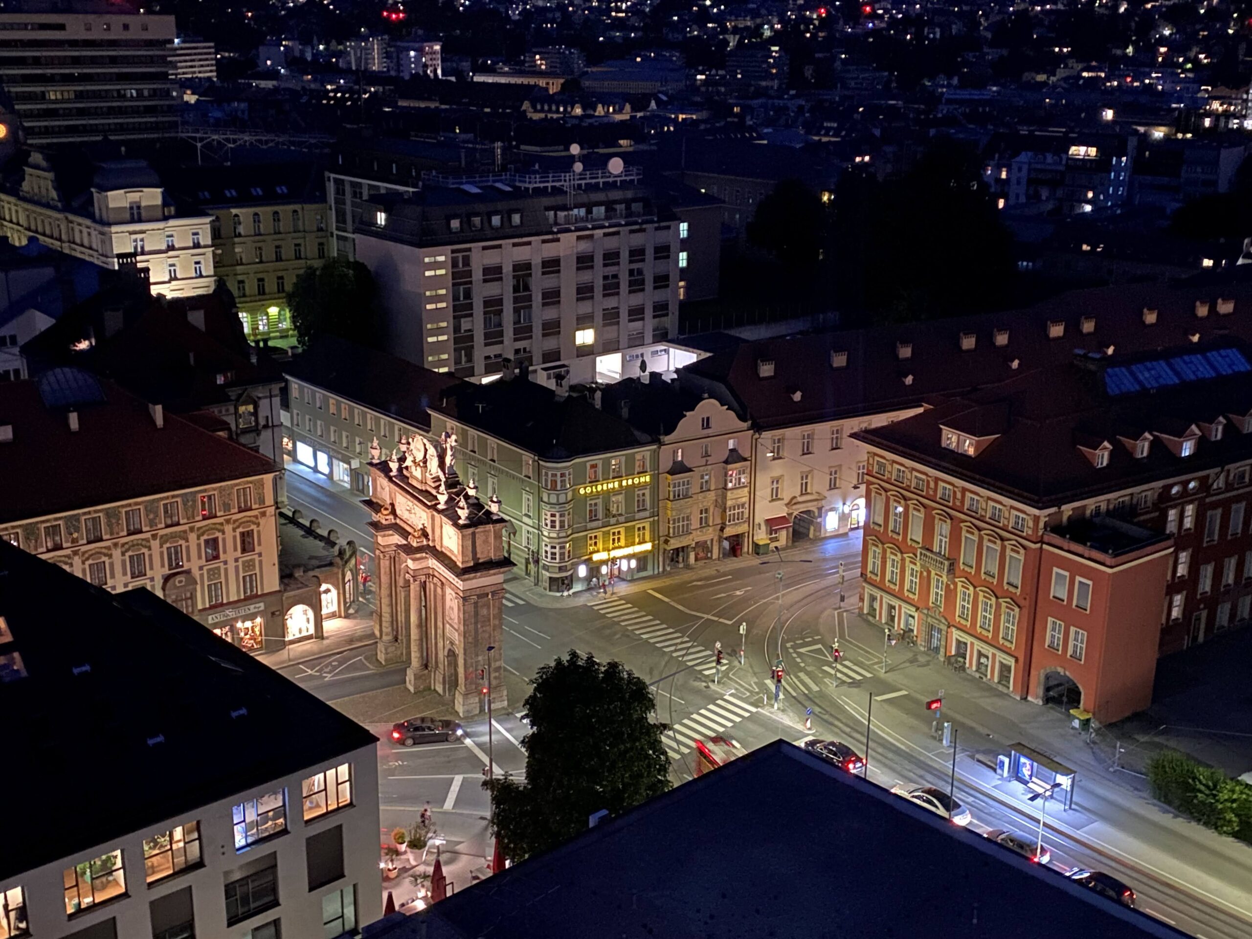 a city at night with buildings and a street