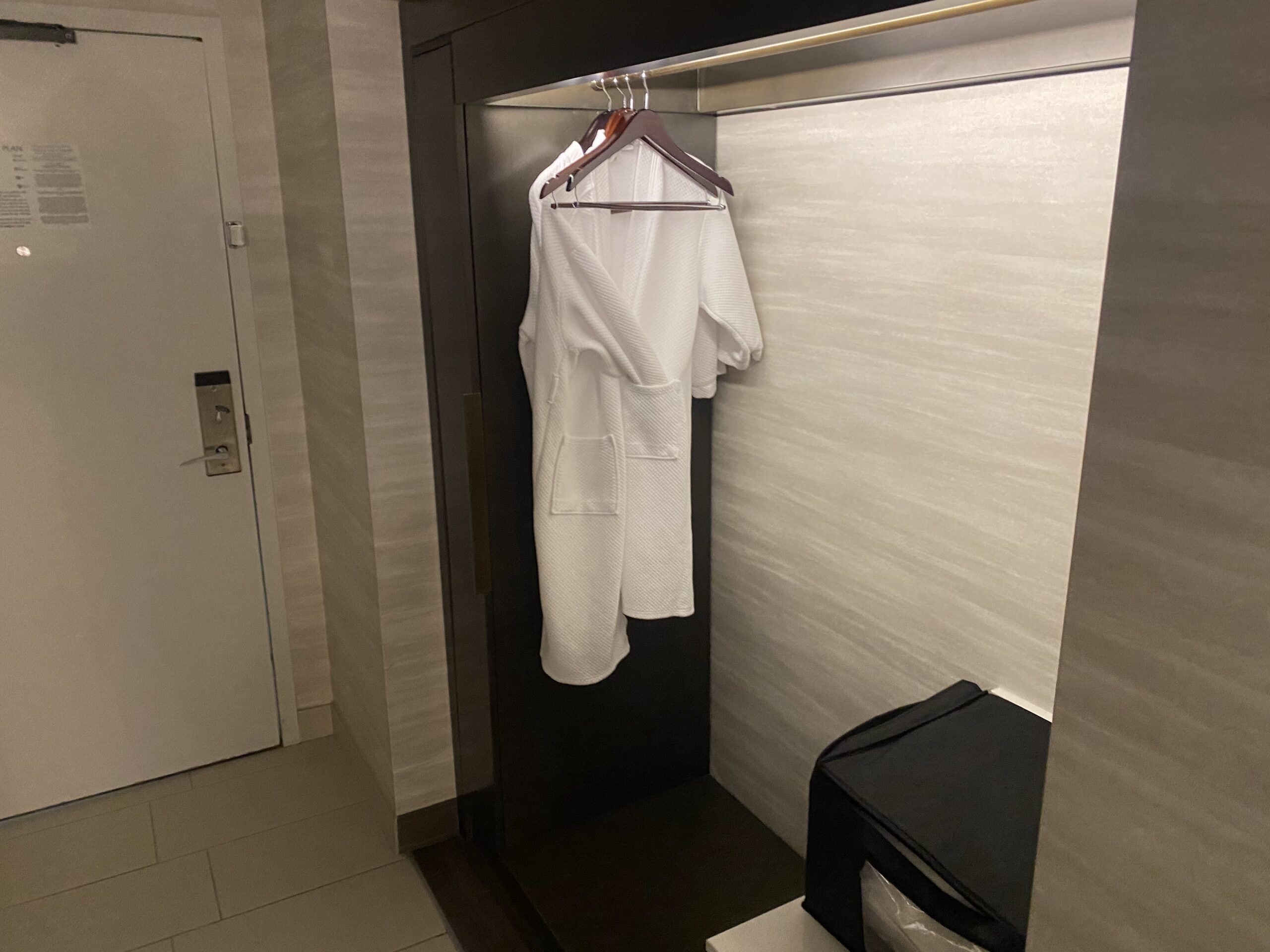a white robe from a swinger in a closet