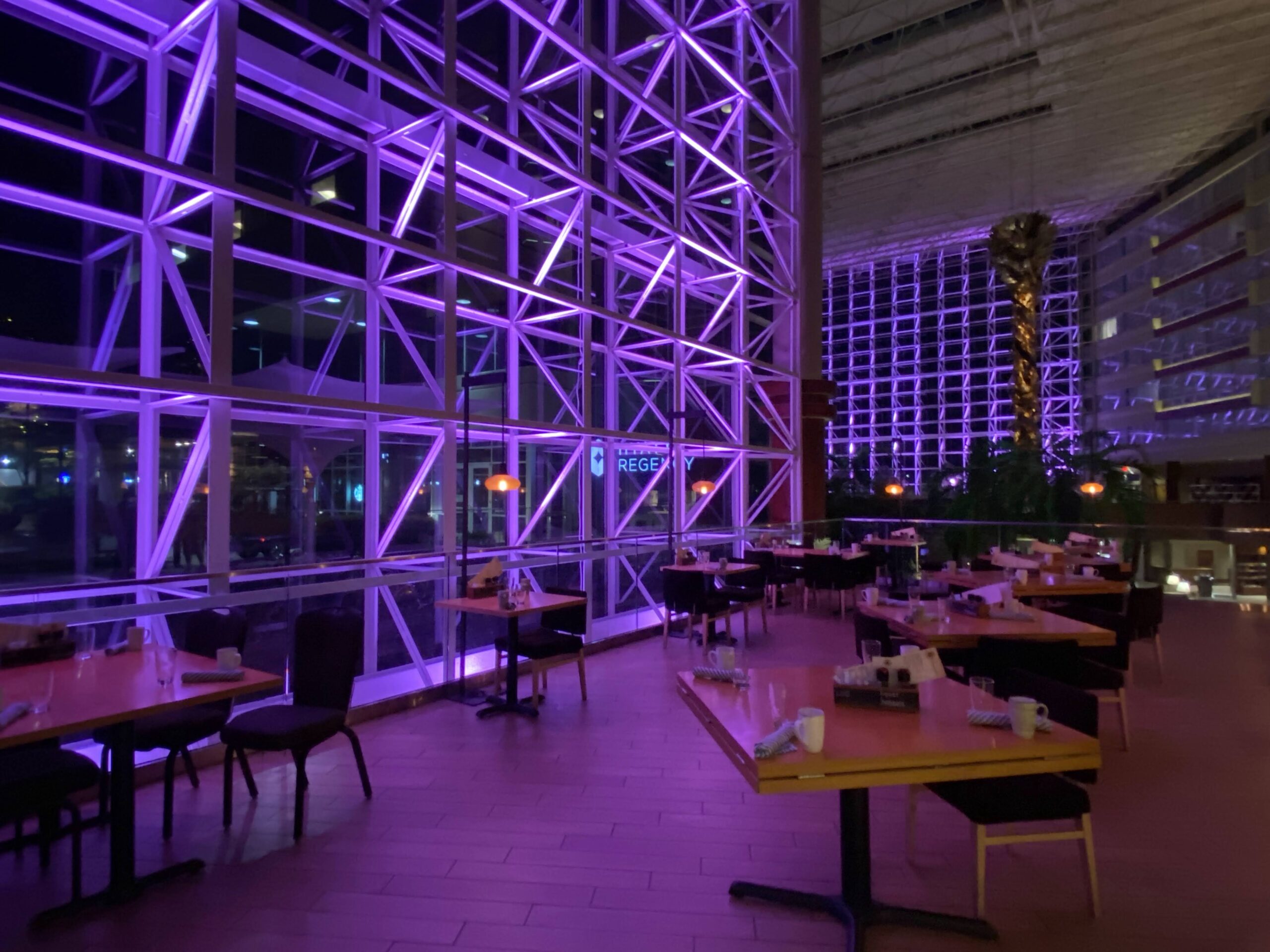 a restaurant with purple lights