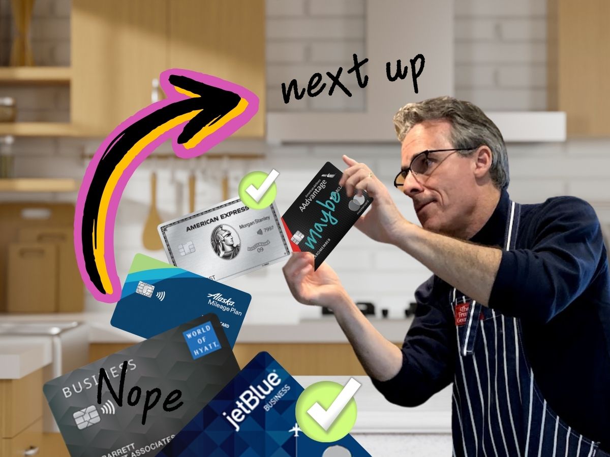 a man holding up a credit card