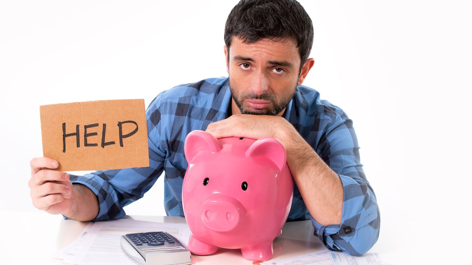 a man leaning on a piggy bank