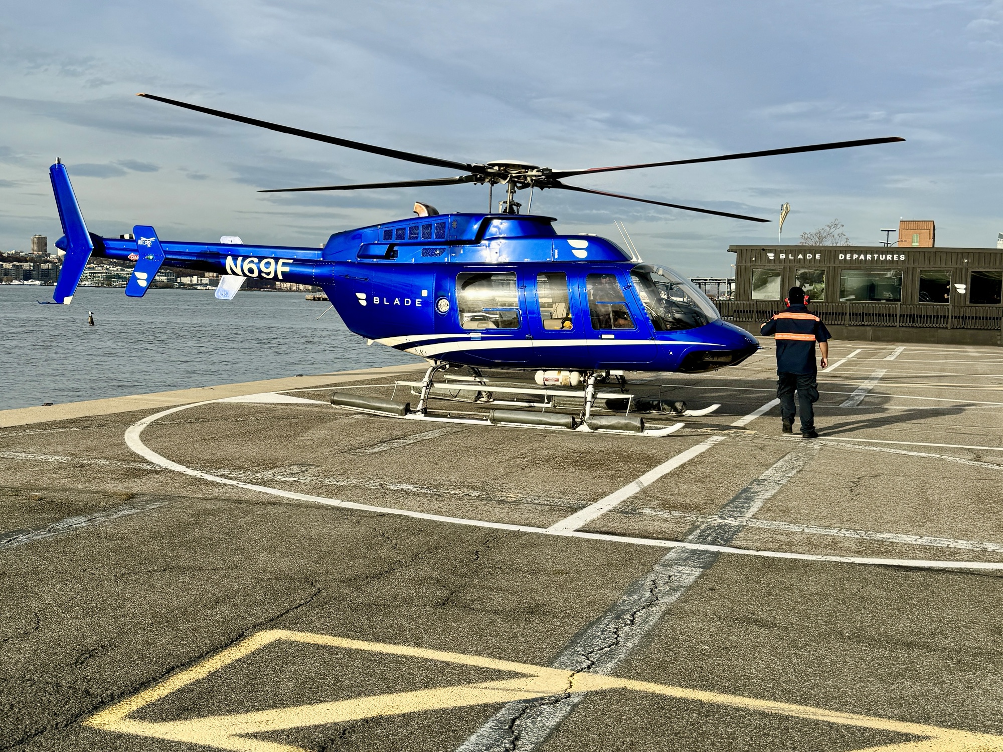 a blue helicopter on a concrete surface