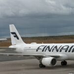 a white airplane on a runway