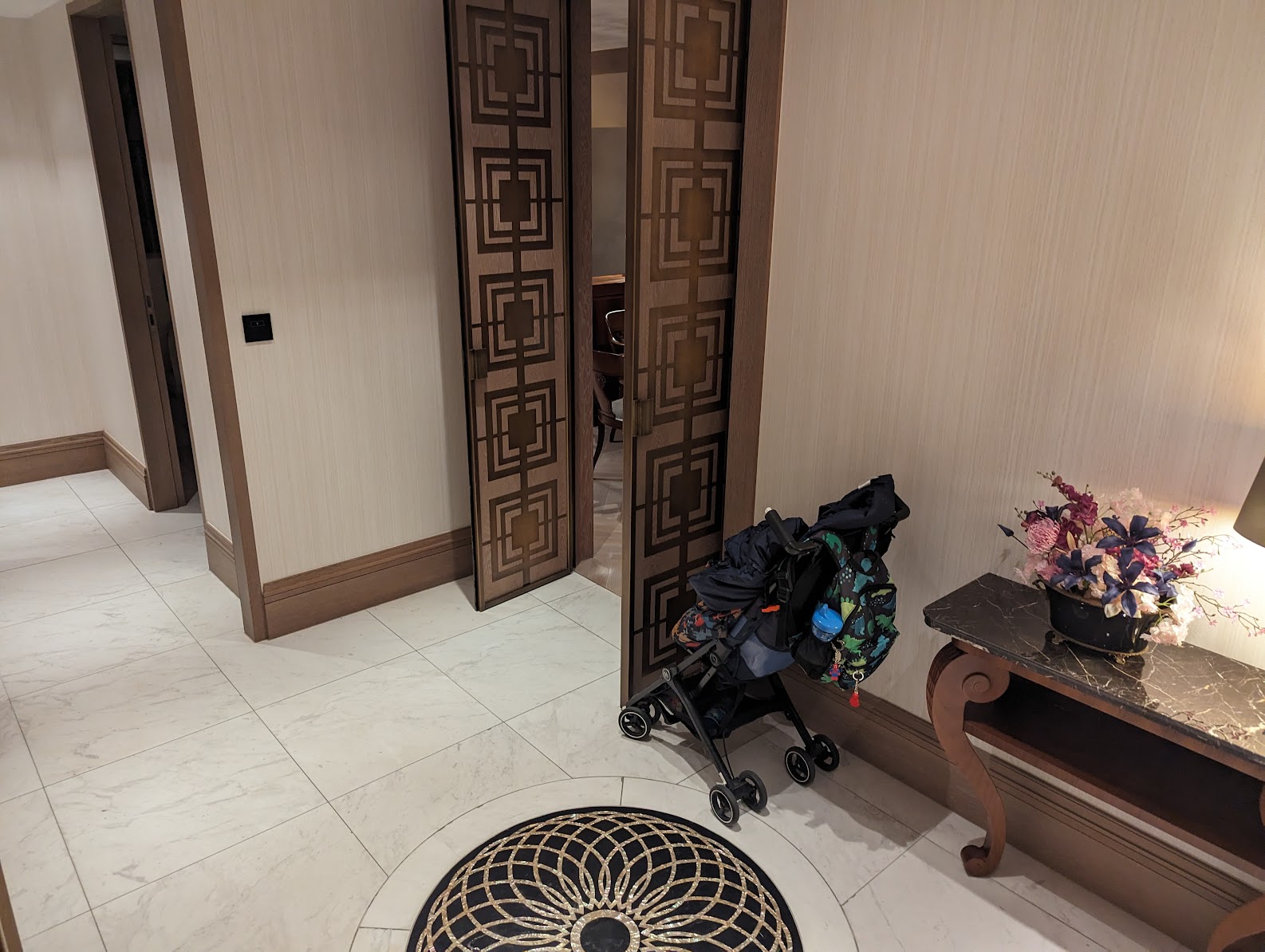 a room with a door and a stroller