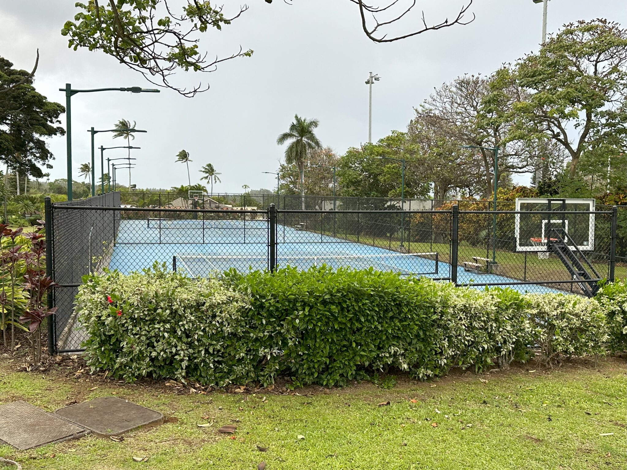 a tennis court with a fence and a net