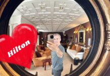 Greg takes photo of himself in mirror while at the Eichard's Private Hotel (a SLH property that is bookable with Hilton points)