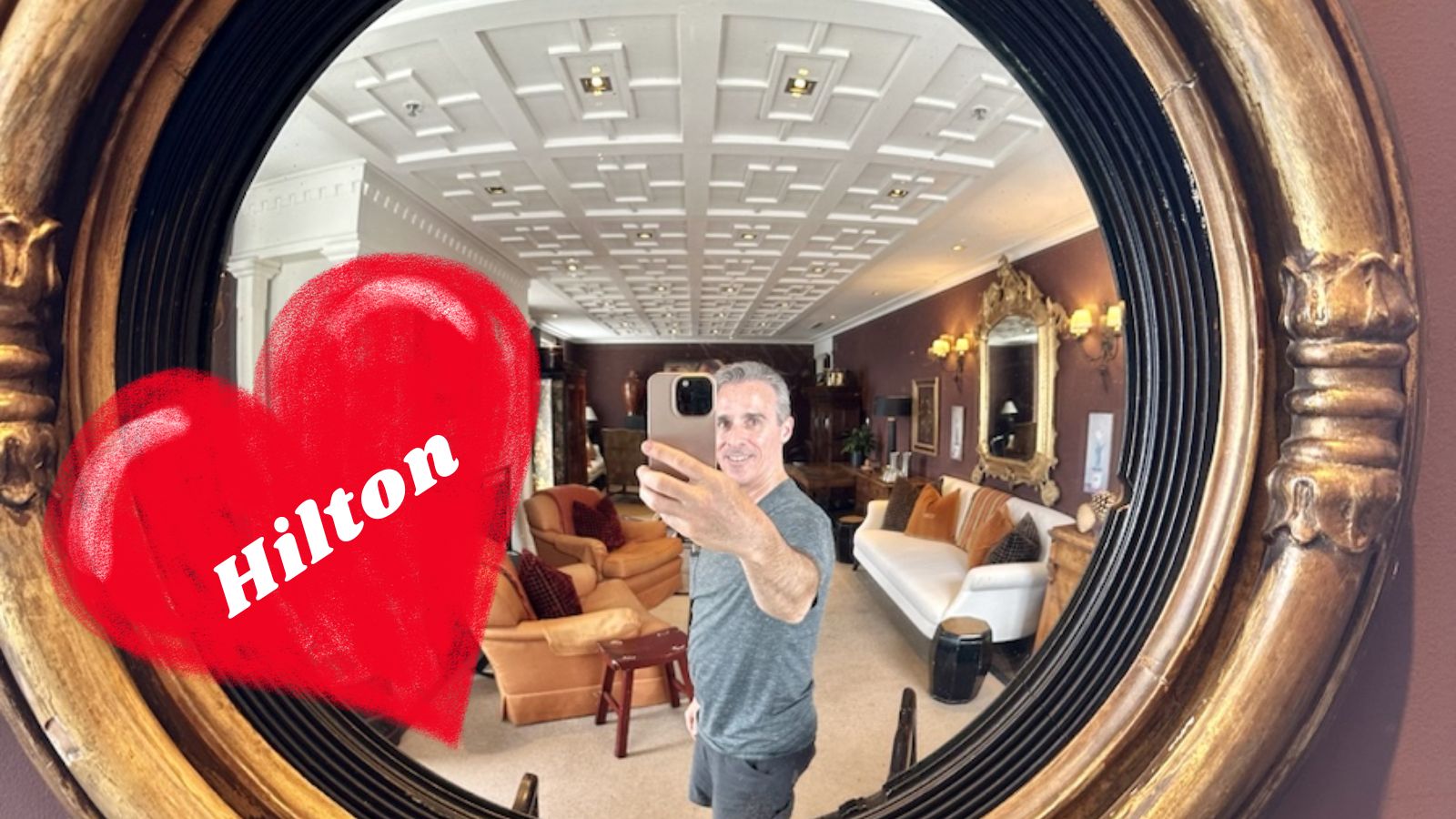 Greg takes photo of himself in mirror while at the Eichard's Private Hotel (a SLH property that is bookable with Hilton points)