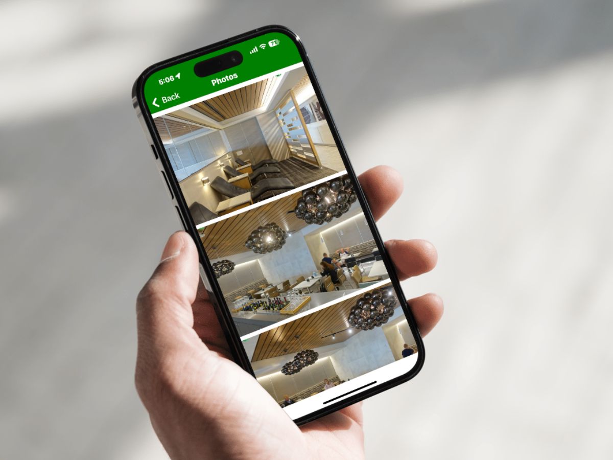 Cell phone showing LoungeReview app looking at airport ORD (Chicago) and the AA Flagship Lounge photos