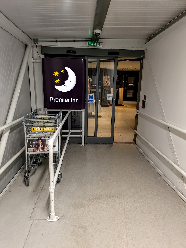 Entrance to the Premier Inn London Heathrow Terminal 4 & cart drop-off.