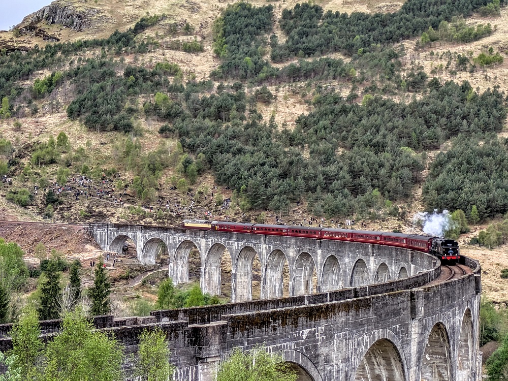 Jacobite steam train passing over the Glenfinnan Viaduct