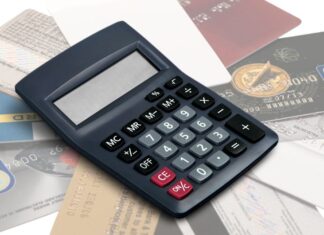 Pile of credit cards with calculator on top