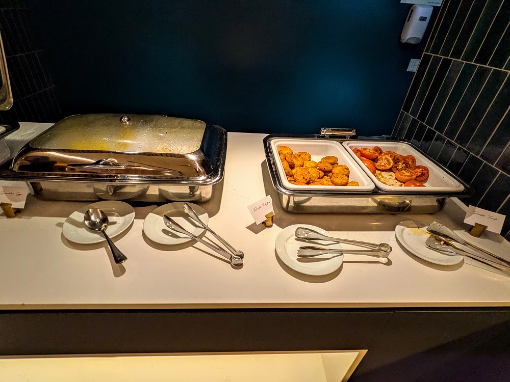 Hyatt House London Stratford breakfast - Scrambled eggs, hash browns, & roasted tomatoes