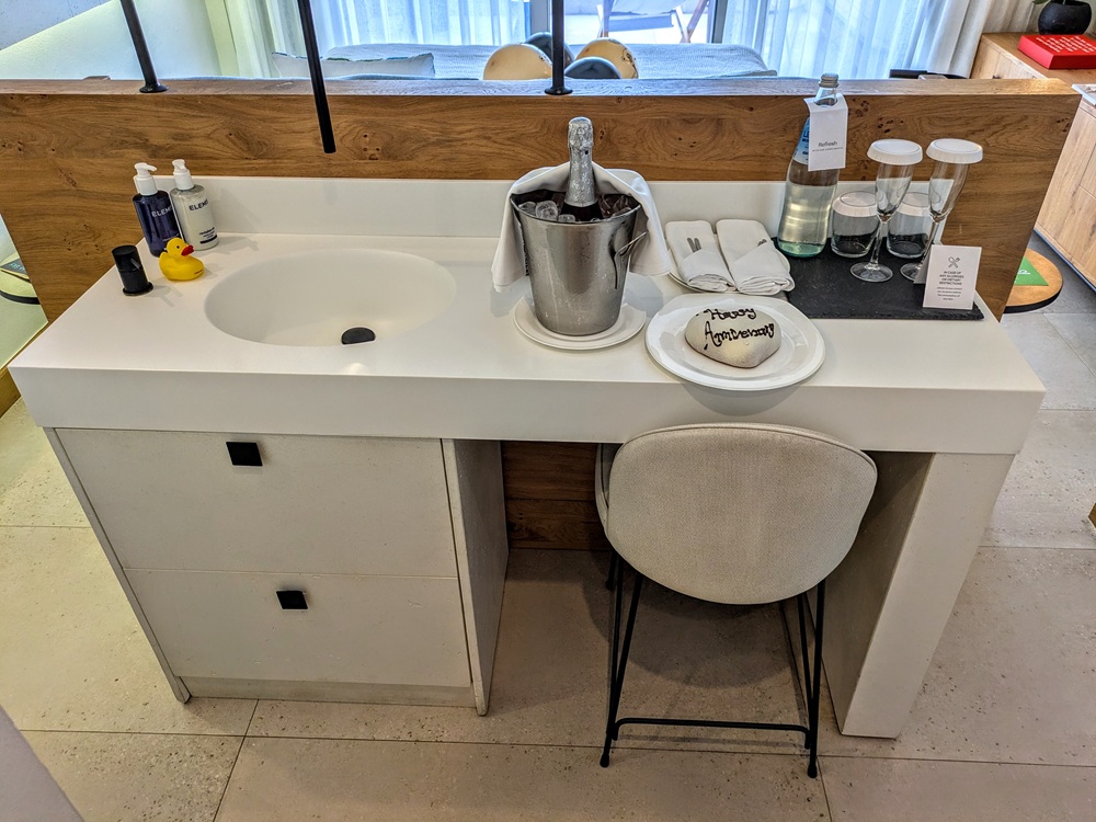 Domes Noruz Chania, Crete - Sink & welcome amenities; the water dispensed out of the black pipe above the sink