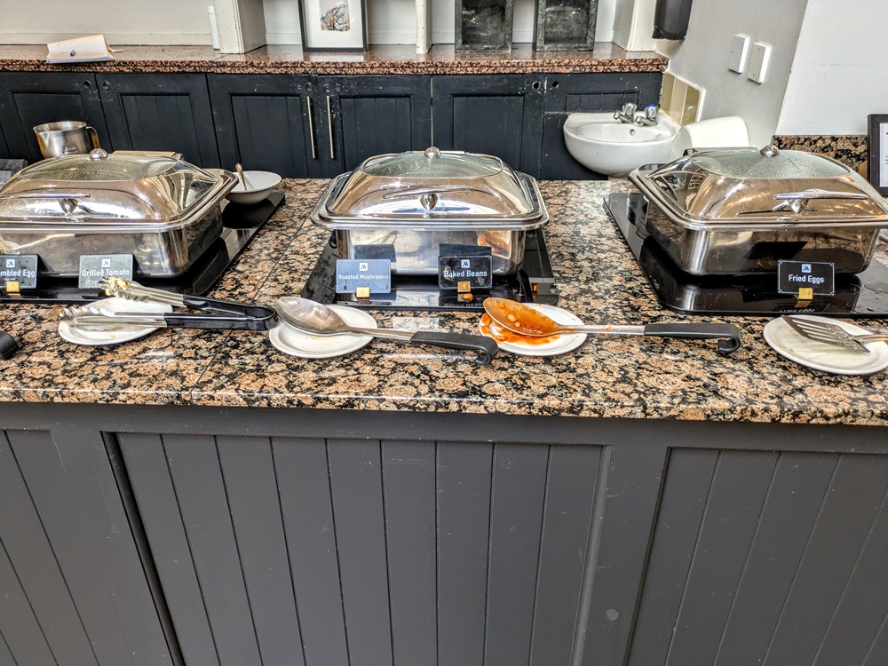 Glasgow Marriott, Scotland breakfast - Scrambled eggs, grilled tomato, roasted mushrooms, baked beans, & fried eggs
